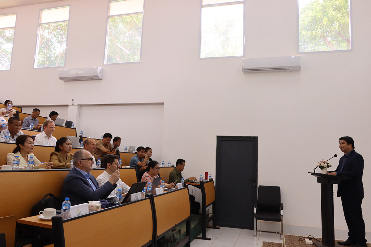 Speaker addressing the audience in an amphitheatre